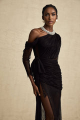 A black maxi dress with a single shoulder strap and a cutout detail featuring a long flowing skirt and fitted bodice