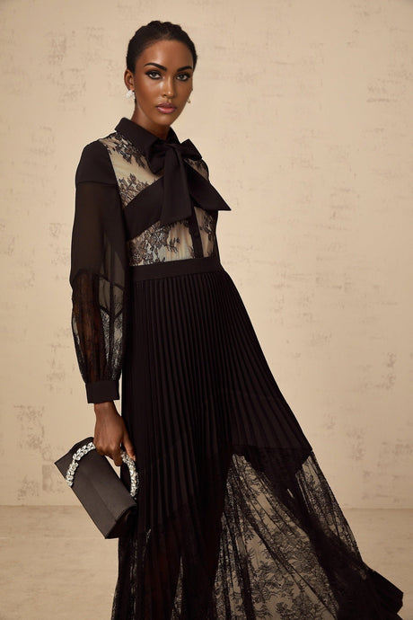 A black maxi dress with pleated design and floral lace panels named Segolene