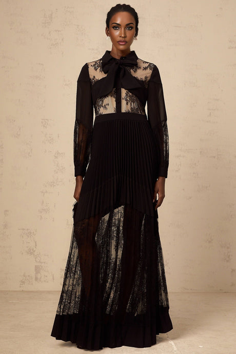 A black maxi dress with pleated skirt and floral lace panels named Segolene
