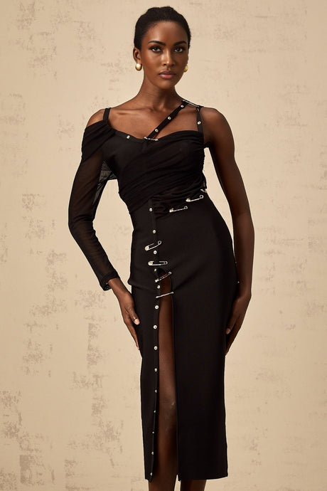 A black midi dress with asymmetric design and cutout details featuring a sleek silhouette and modern style