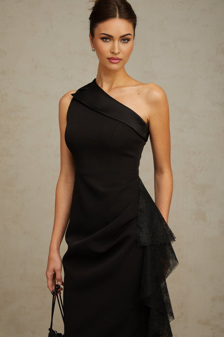 A black midi dress with asymmetric hem featuring lace panels and a sleek silhouette