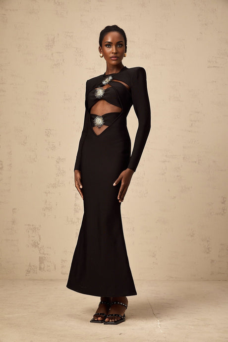 A black midi dress with cutout details featuring a sun motif pattern and ruched fabric Astrid style with a fitted silhouette