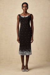 A black midi dress with faux pearl embellishments called Apolline