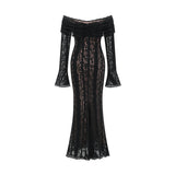 A black midi dress with floral lace detailing and flared cuffs named Emeline shown on a model or mannequin