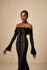 A black midi dress with floral lace detailing and flared cuffs named Émeline