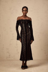 A black midi dress with floral lace pattern and flared cuffs named Emeline