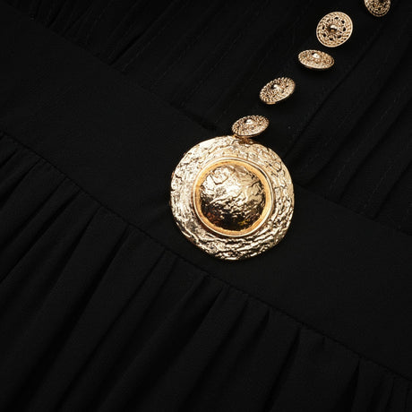 A black midi dress with pleated fabric and buttonfront design featuring long sleeves and a feminine silhouette
