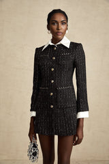 A black mini dress featuring a combination of tweed fabric and sequin panels named Audrey