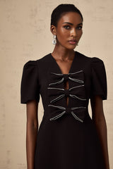 A black mini dress with a bowknot embellishment named Tania