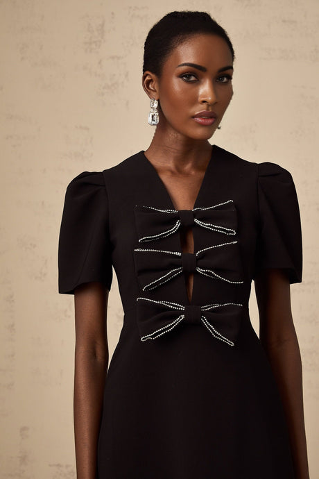 A black mini dress with a bowknot embellishment named Tania