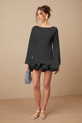A black mini dress with a bubble skirt featuring a fitted bodice and short puffed sleeves