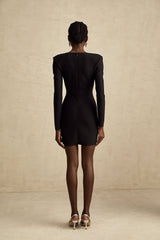 A black mini dress with a bustier top covered in shimmering sequins featuring a sleeveless design and form fitting silhouette