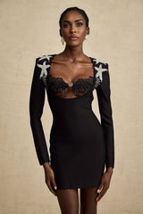 A black mini dress with a bustier top covered in shiny sequins