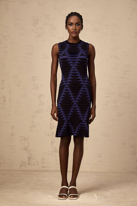 A black mini dress with a snake pattern design featuring a godet skirt and named Anais