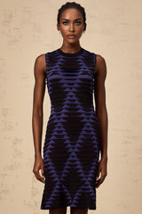 A black mini dress with a snake pattern design featuring a godet skirt silhouette