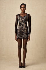 A black mini dress with delicate floral embroidery and lace detailing featuring a feminine silhouette and intricate patterns