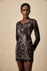 A black mini dress with delicate floral embroidery and lace details featuring a feminine silhouette
