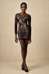 A black mini dress with delicate floral embroidery on lace fabric featuring a short hemline and intricate lace detailing throughout