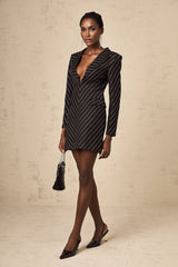 A black mini dress with embellished stripes and a formfitting silhouette named Mireille