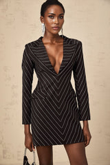 A black mini dress with embellished stripes featuring the name Mireille