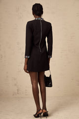 A black mini dress with long sleeves and crystal embellishments named Juliette
