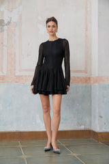 A black mini dress with puff sleeves and pointelle knit pattern named Helene