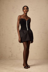 A black mini dress with ruched detailing and puff sleeves named Francis