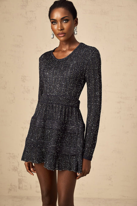 A black mini dress with sequin embellishments and a knitted texture featuring a short hemline and likely formfitting silhouette