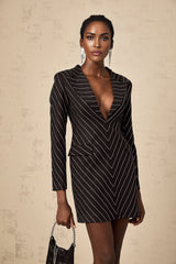 A black mini dress with stripes and embellishments called Mireille