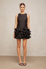 A black mini dress with tiered ruffles and a short hemline named Therese