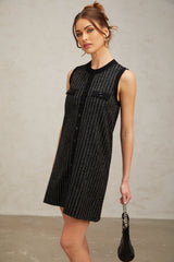 A black mini dress with vertical stripes and sequin embellishments featuring a knit fabric and short length named Zelda