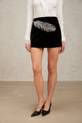 A black mini skirt with feather embroidery and embellishments named Myriam