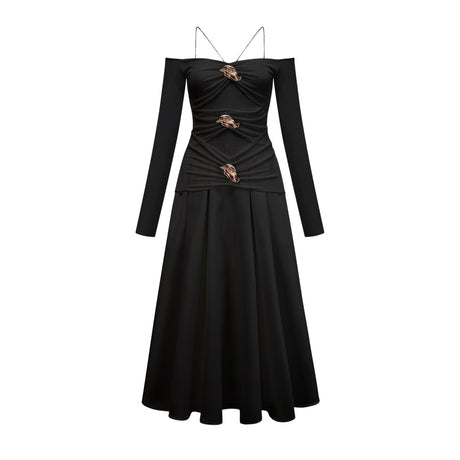 A black offshoulder maxi dress with panelled design featuring a long flowing skirt and fitted bodice worn by a model