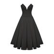 A black offshoulder midi dress with a corsetstyle bodice worn by a model standing against a plain background