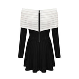 A black offshoulder mini dress with a bow detail and knit fabric featuring a formfitting silhouette