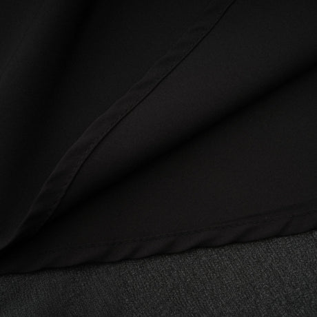 A black pleated midi dress with a button front closure featuring long sleeves and a fitted waist