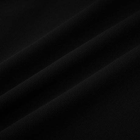 A black pleated midi dress with a buttonfront design and a flowing silhouette named Viviane
