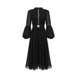 A black pleated midi dress with a buttonfront design featuring long sleeves and a flowing silhouette