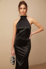 A black satin maxi dress with a halterneck style adorned with faux pearls named Ginevra