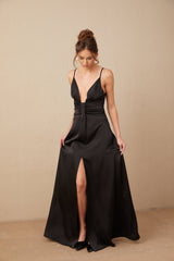 A black satin maxi dress with a V neckline and front slit named Blanche
