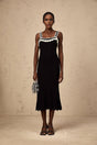 A black sleeveless midi dress with a crochet knit pattern throughout the garment