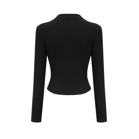 A black sleeveless top with an open front and gathered fabric details worn by a model