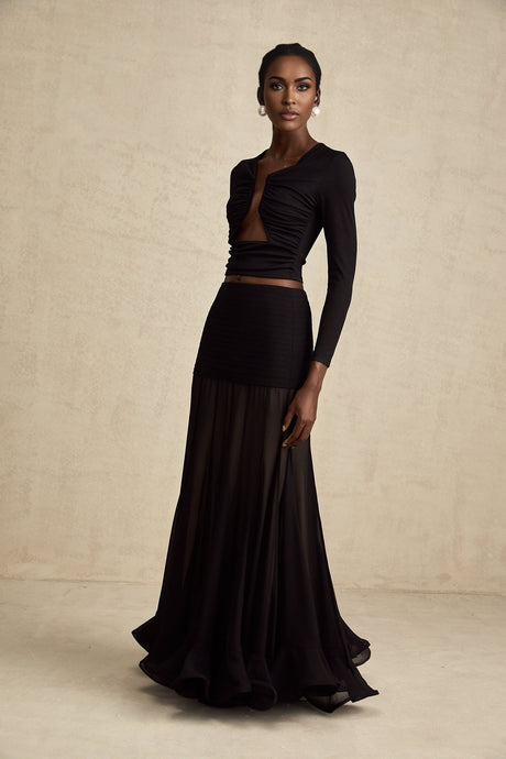 A black sleeveless top with an open front design and gathered fabric detailing