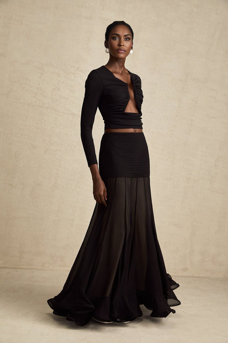 A black sleeveless top with an open front design and gathered fabric details