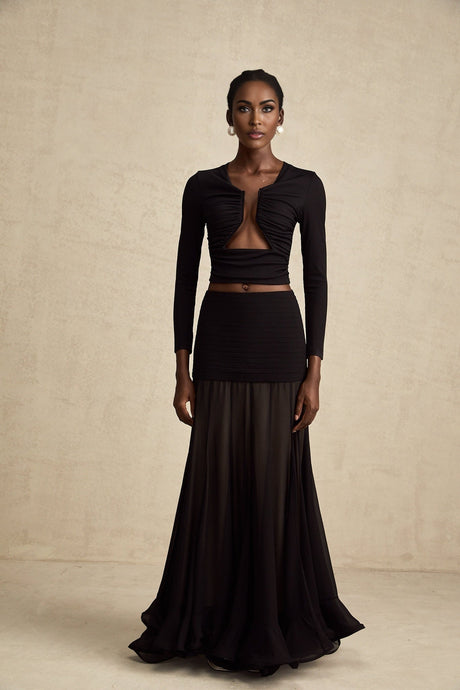 A black sleeveless top with an open front design and gathered fabric details