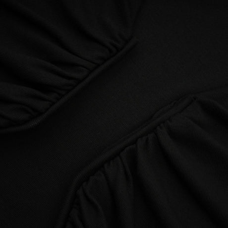 A black sleeveless top with an open front design and gathered fabric details