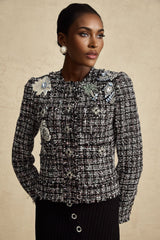 A black tweed jacket with a checkered pattern featuring frayed edges named Justine