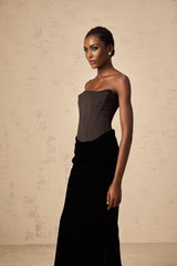 A black velvet maxi dress with an offshoulder neckline called Aurore