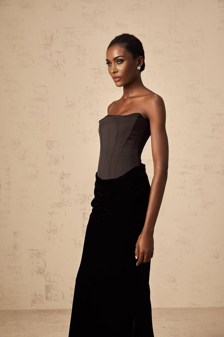 A black velvet maxi dress with an offshoulder neckline called Aurore