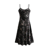 A black velvet midi dress with a butterfly print pattern featuring a fitted bodice and flared skirt